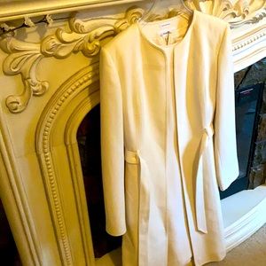 White Calvin Klein dress and matching coat.